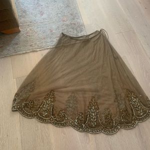 Mesh & hand embroidered over-skirt.  green (brown, black light blue beading).